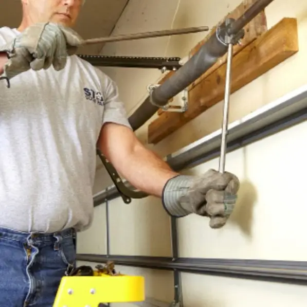 DIY garage door spring and cable replacement process with tools in Durham NC