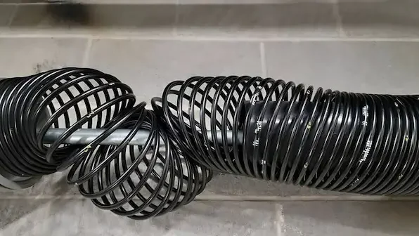 Broken garage door spring failure being repaired same day by technician in Durham NC